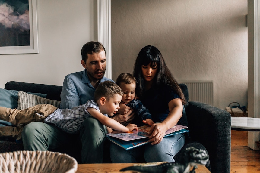 Chryssie Swabrick, pictured with her husband and two sons inside their house