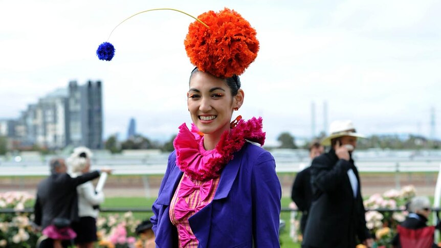 Angela Menz shows off her outfit at Flemington race track.