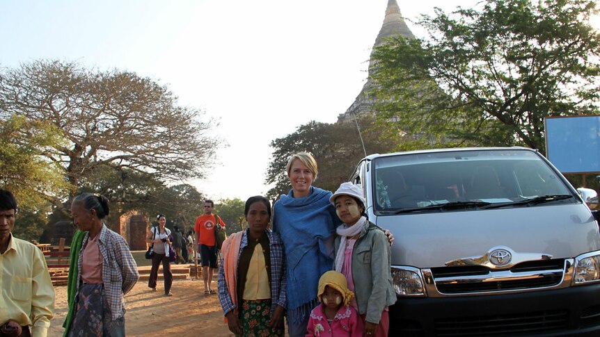 Zoe Daniel poses with locals at the Bagan temples in Burma.