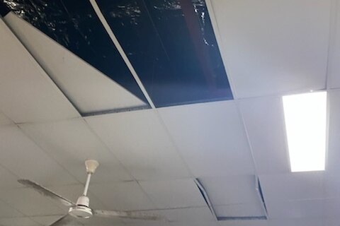 The ceiling of the arm disposal store, which has been ripped out.