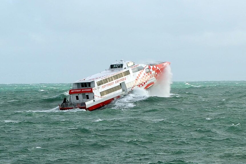 The Rottnest Express ferry battles a large swell as it heads to Rottnest Island.
