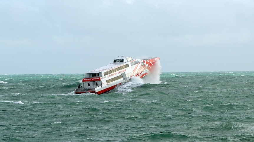 The Rottnest Express ferry battles a large swell as it heads to Rottnest Island.