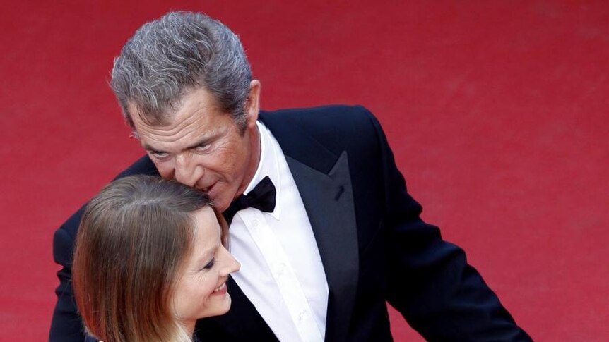 Director and actress Jodie Foster and actor Mel Gibson embrace on the red carpet
