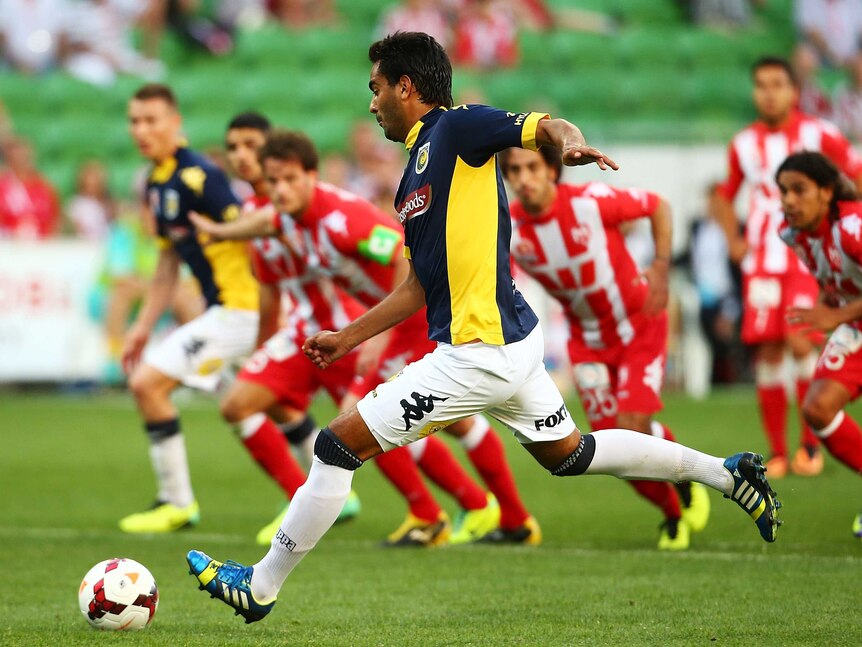 Central Coast's Marcos Flores scores a penalty against Melbourne Heart at AAMI Park.