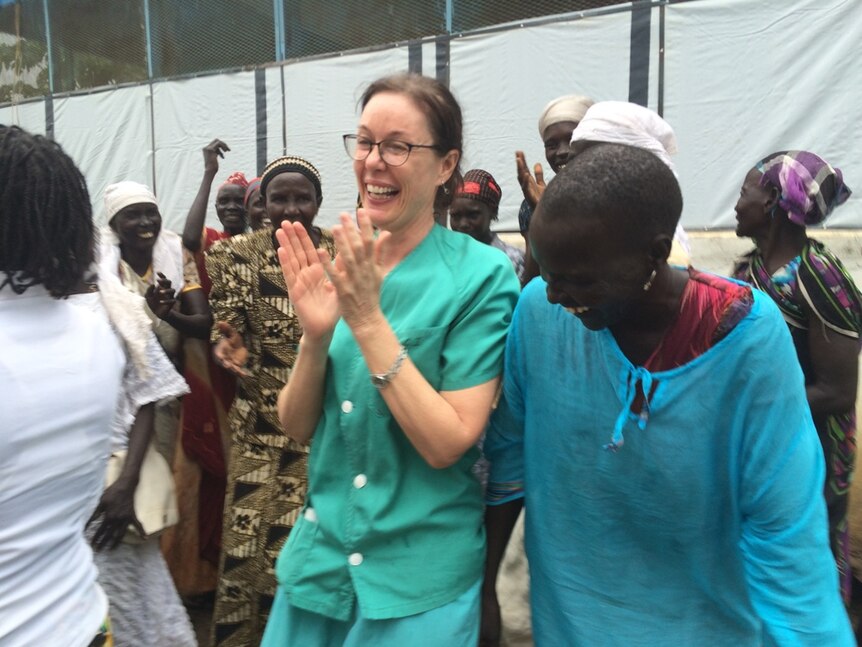 Toni Stokes singing and dancing with birth attendants in South Sudan