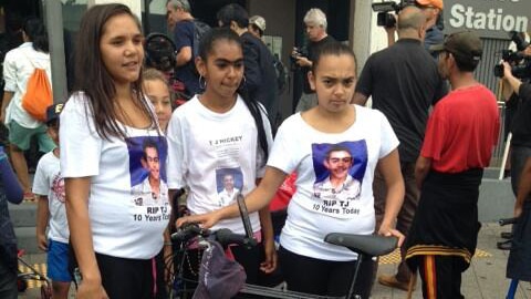 Relatives of "TJ" Hickey with his bicycle