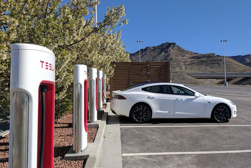 Tesla electric car at a charging station