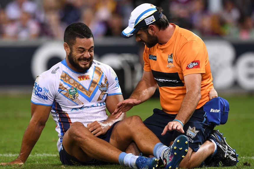 Jarryd Hayne receives treatment for injury against the Storm.