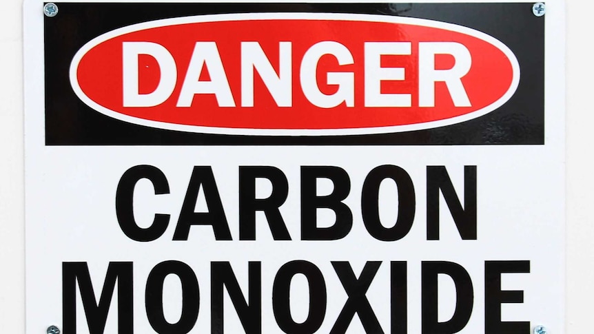 A back, white and red sign reading 'danger, carbon monoxide' in bold letters.