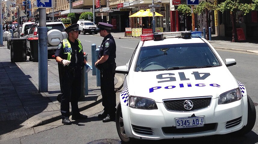 Police on Hindley Street where a body was found