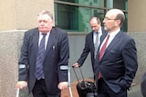 Tasmanian DPP Tim Ellis leaves Magistrates Court in Hobart with lawyer Michael O'Farrell (r),  March 2014.