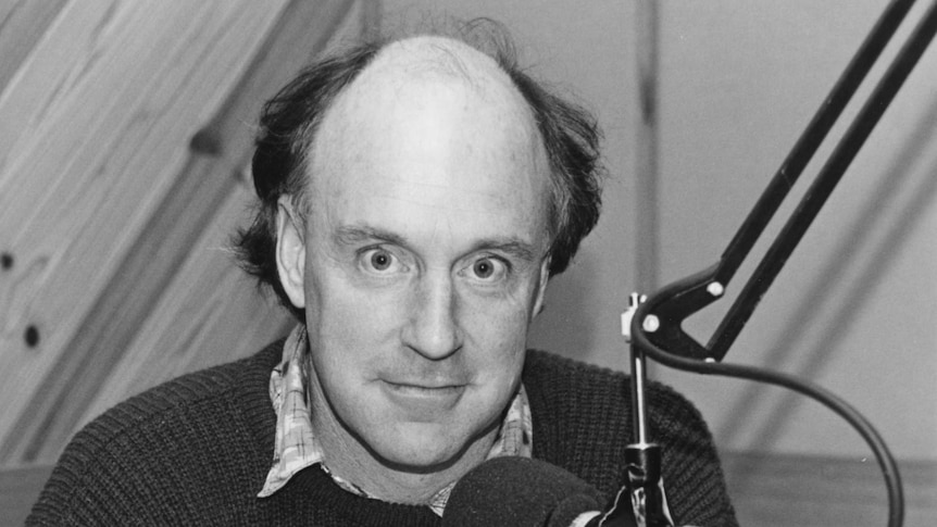 John Clarke, in 3LO studio, 1987, behind microphone.