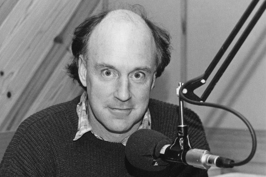 John Clarke, in 3LO studio, 1987, behind microphone.