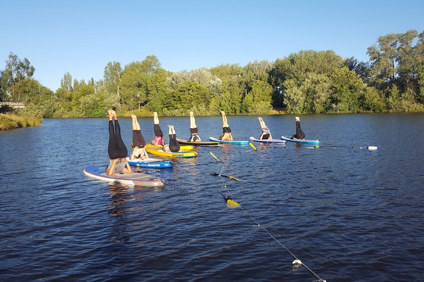 Yoga classes on Lake Burley Griffin.