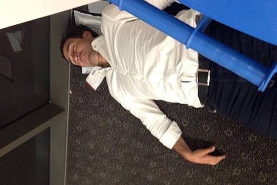 Andrew Johns sleeping at Toowoomba airport