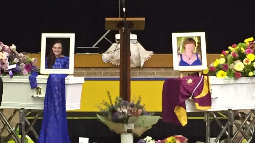 Pictures of Rachel Erlandsen, 17, and her mother Dixie, 50, sit atop their coffins for their funeral.