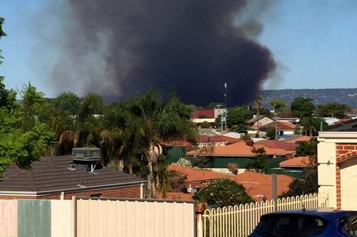 A bushfire threatens homes in Perth suburbs of Bassendean and Ashfield 5 March 2015
