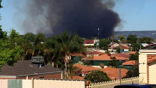 A bushfire threatens homes in Perth suburbs of Bassendean and Ashfield 5 March 2015