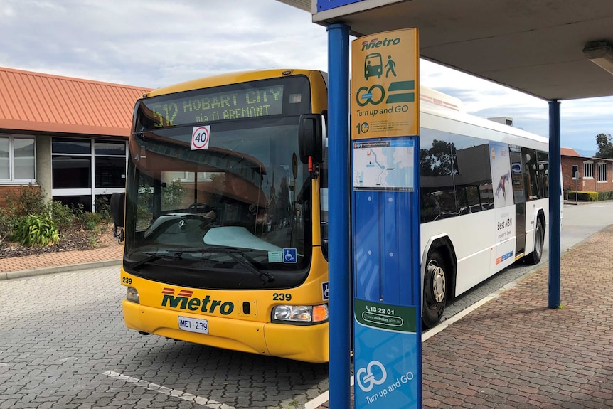 A metro bus parked at a stop