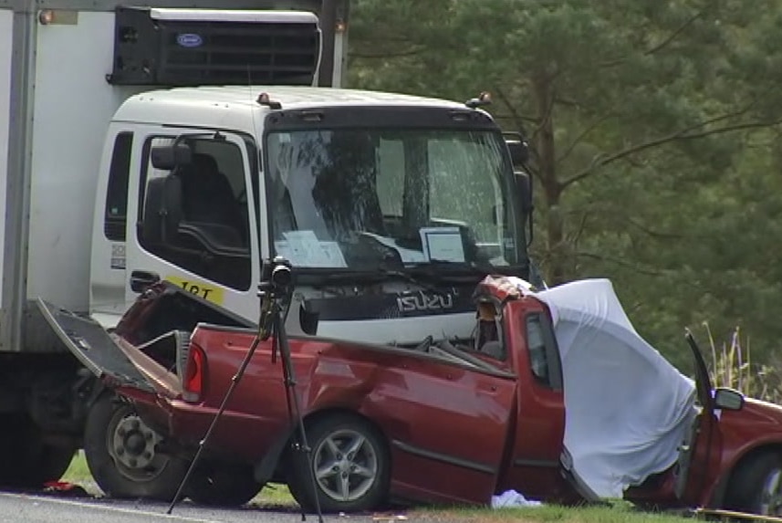 The wreckage of a collision between a truck and a ute.