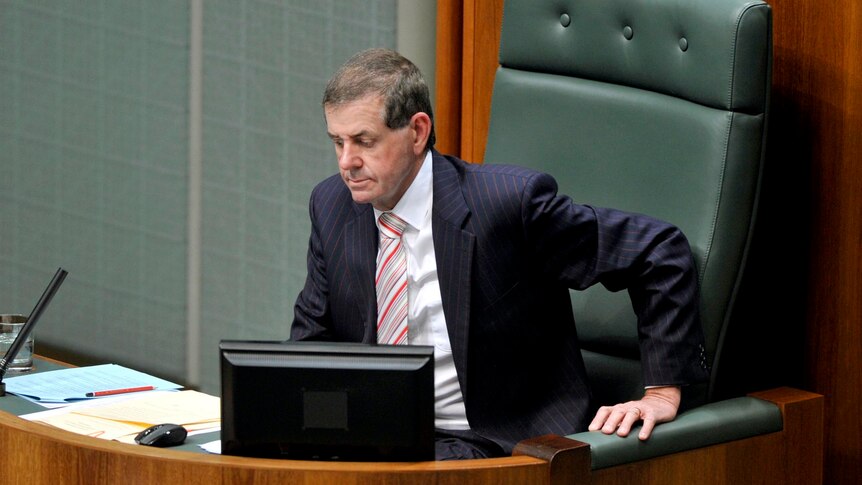 Peter Slipper takes the chair during a Parliamentary debate.