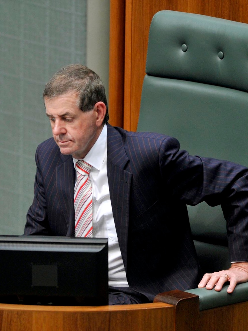 Peter Slipper takes the chair during a Parliamentary debate.