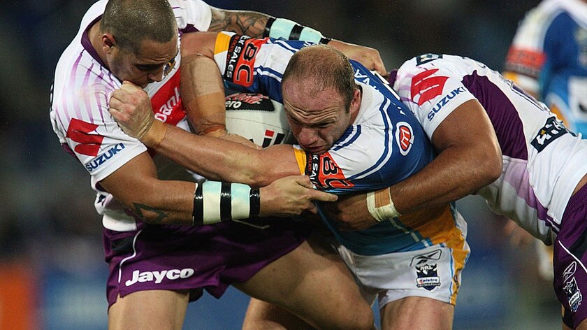 Luke Bailey is tackled by Jeremy Smith.