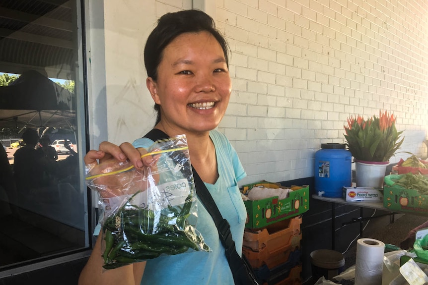 A woman standing inside the Rapid Creek markets