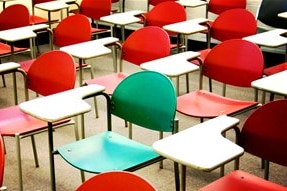 Desks and chairs in a classroom.
