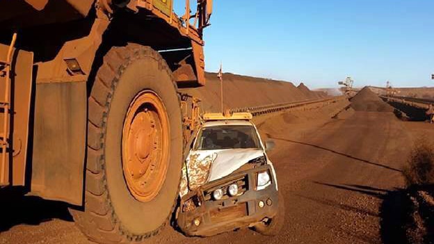 A mining truck at Rio Tinto's Brockman 4 mine in the Pilbara almost crushes a 4WD. July 30, 2014