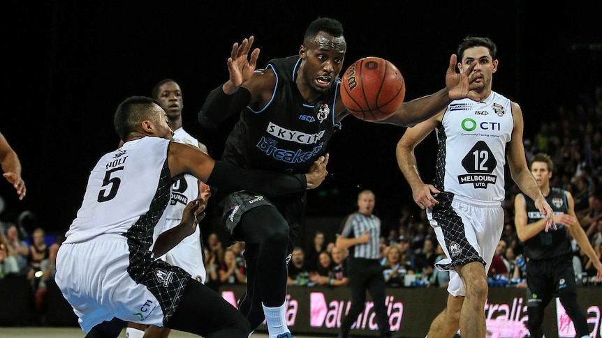 Cedric Jackson challenges for the ball against Melbourne United