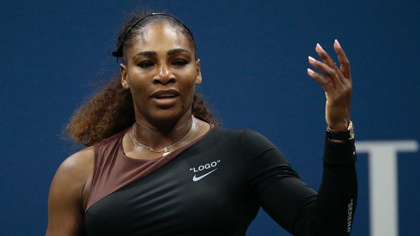 From the other side of the net, Serena Williams is seen throwing her hand in the air in a shrug.