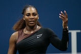 From the other side of the net, Serena Williams is seen throwing her hand in the air in a shrug.