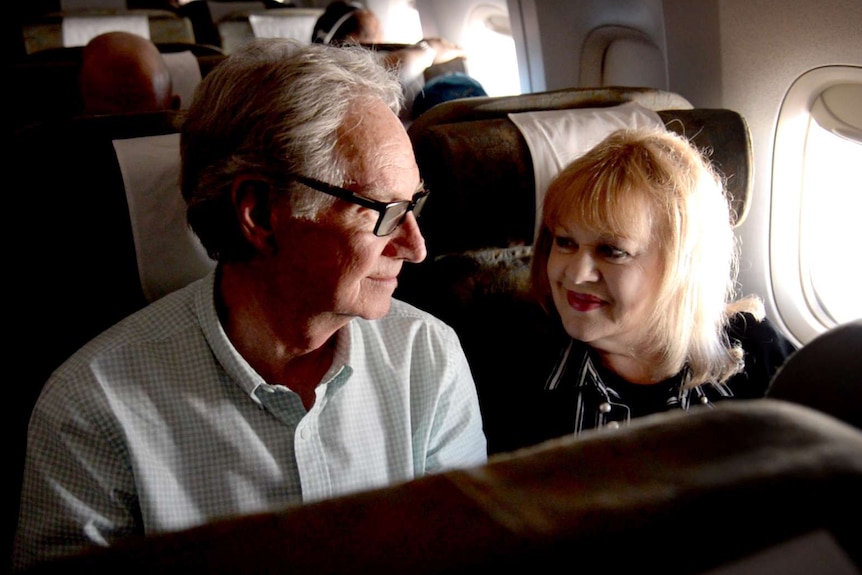Patricia Amphlett (aka Little Pattie) and her husband Lawrie Thompson smile at eachother on the plane to Vietnam.