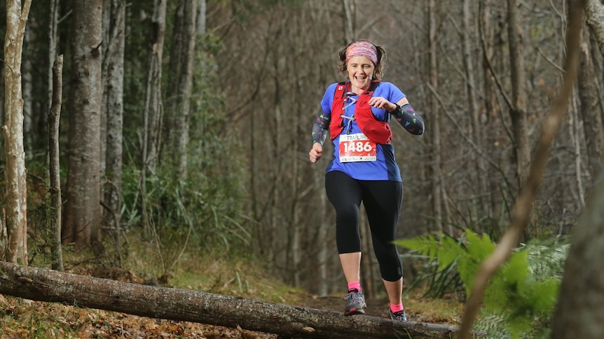 A woman running in bushland