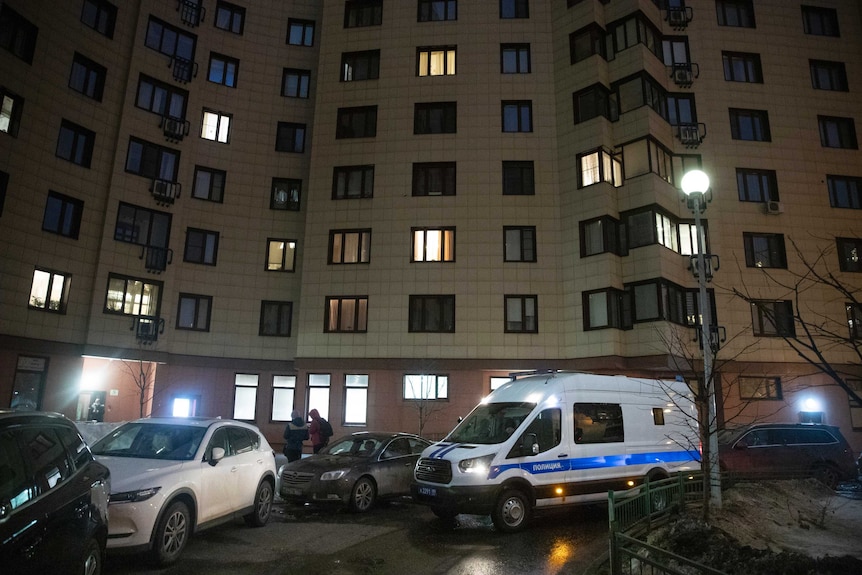 A Russian police van is parked at the apartment building of jailed opposition leader Alexei Navalny in Moscow.