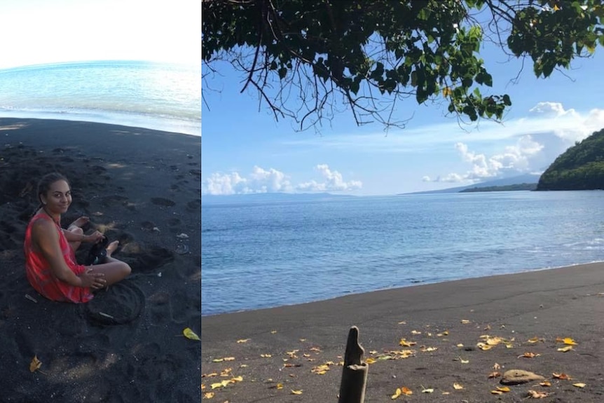 Rachel Warcon sits on a black sand beach, with crystal blue water.