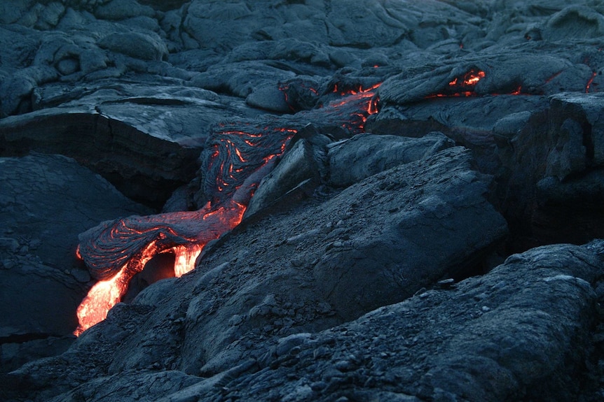 Hot lava on side of a mountain