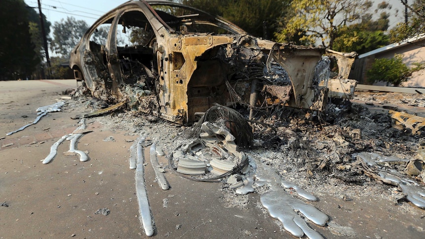 Molten aluminium is seen after flowing from a car that burned on a road