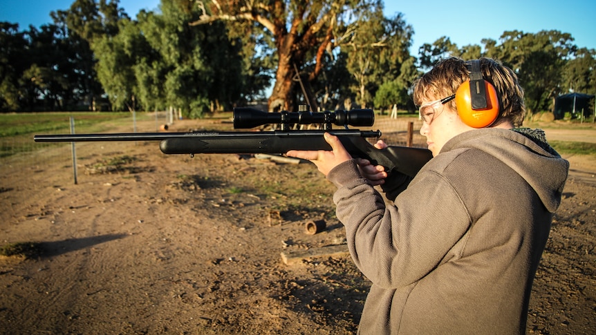 Roanan Fletcher, 13, holding a .22 calibre rifle.