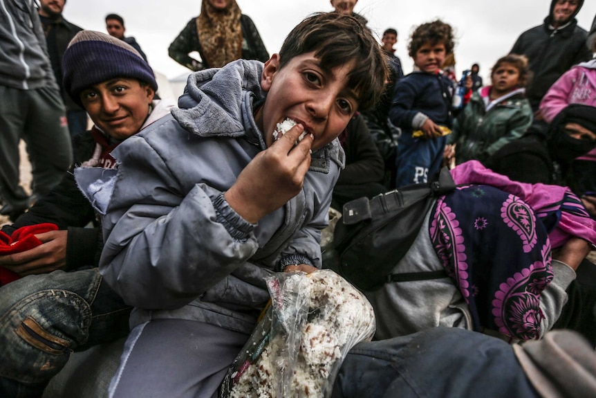 Syrian asylum seekers are pictured in a camp near the Turkish border.