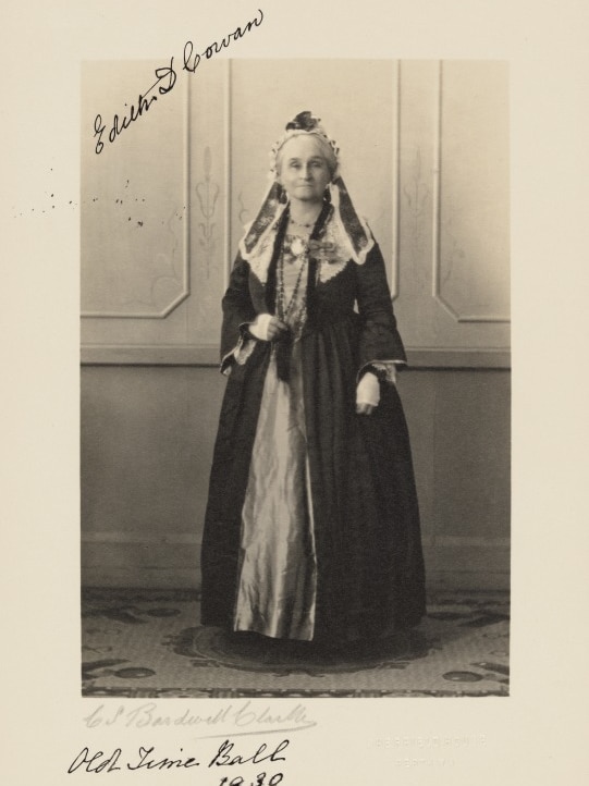 Old picture, black and white, of Edith Cowan wearing fancy dress. She is half smiling and there is writing on the photo.