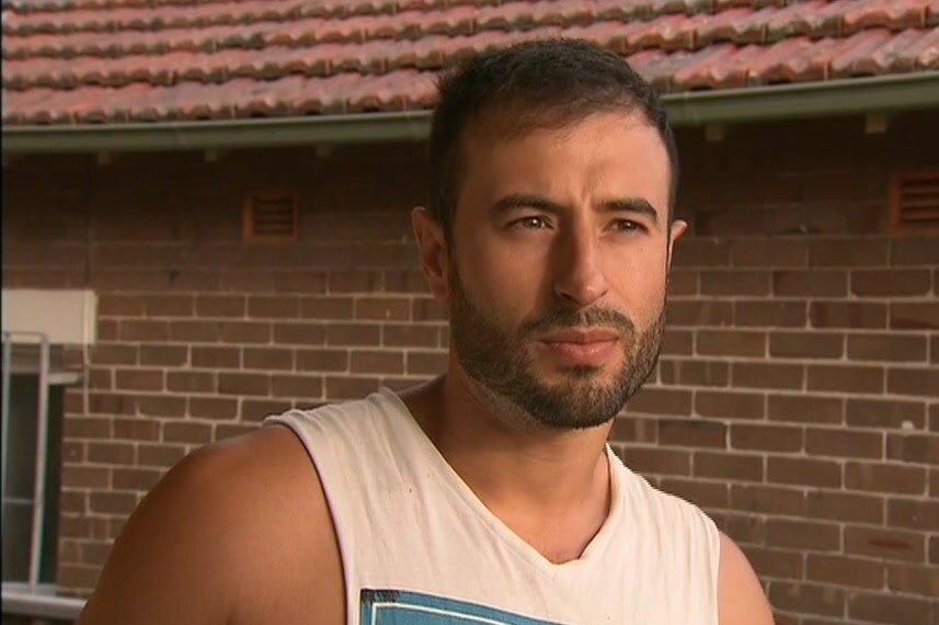 A man at the front of his house