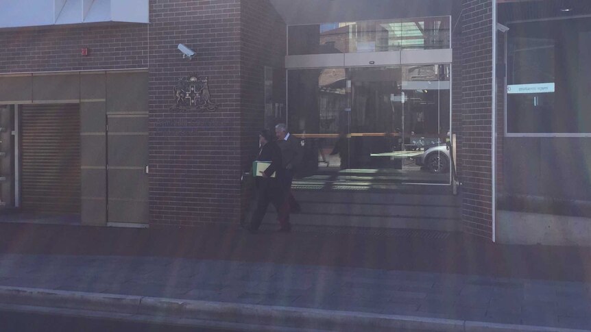 Ian Berryman leaves Armidale Local Court with his legal representative
