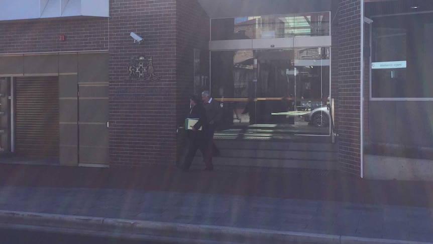 Ian Berryman leaves Armidale Local Court with his legal representative