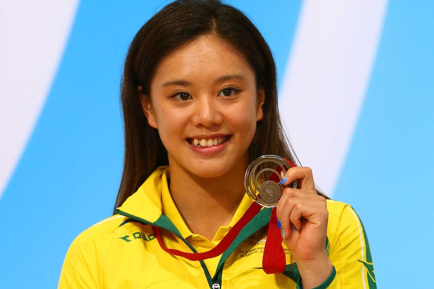 Esther Qin with her bronze diving medal