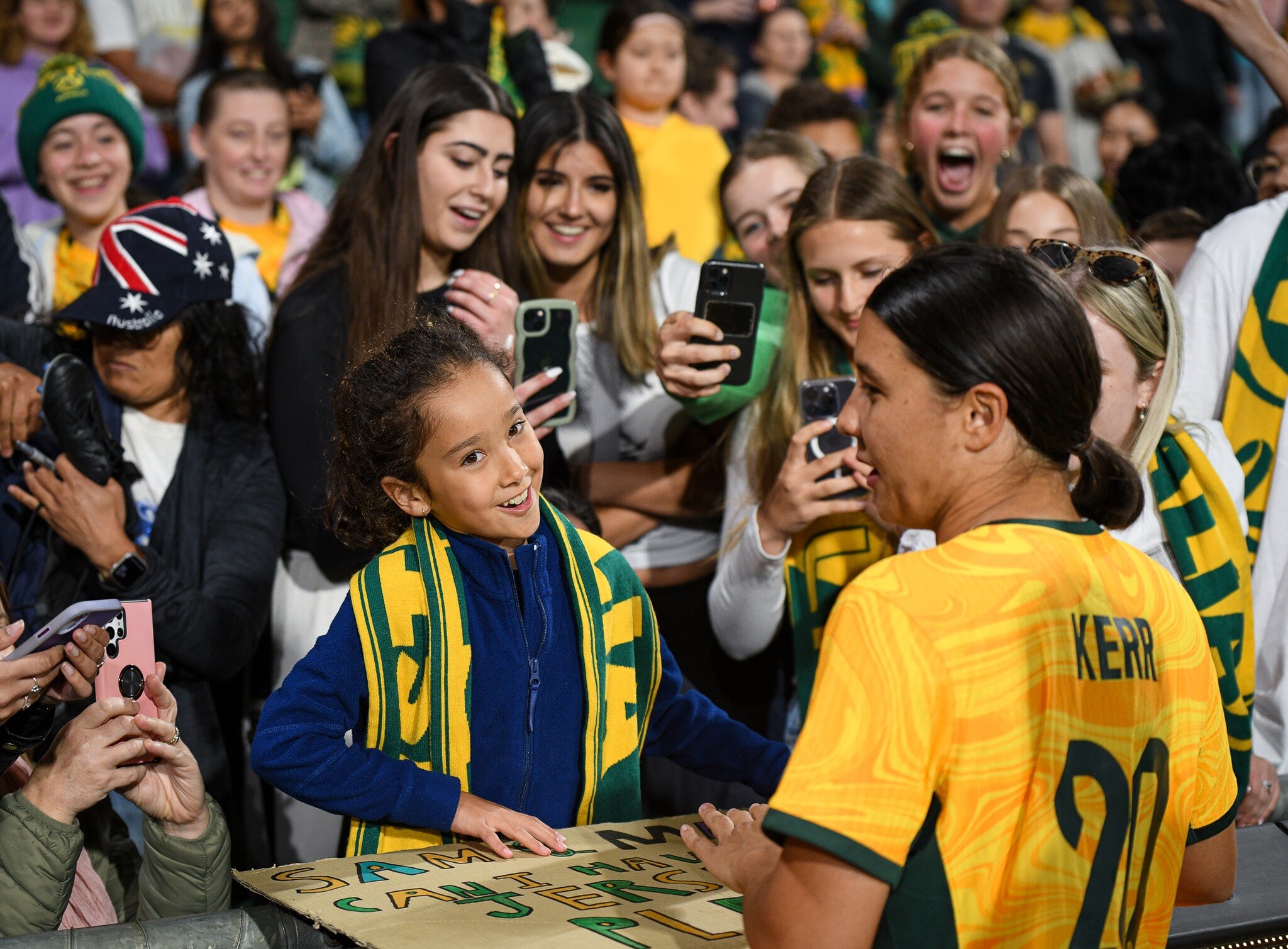 Matildas star Sam Kerr meets an excited fan. 