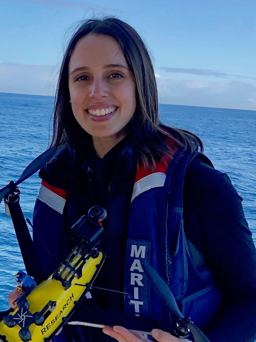 Dr Vanessa Pirotta on a boat with a drone.