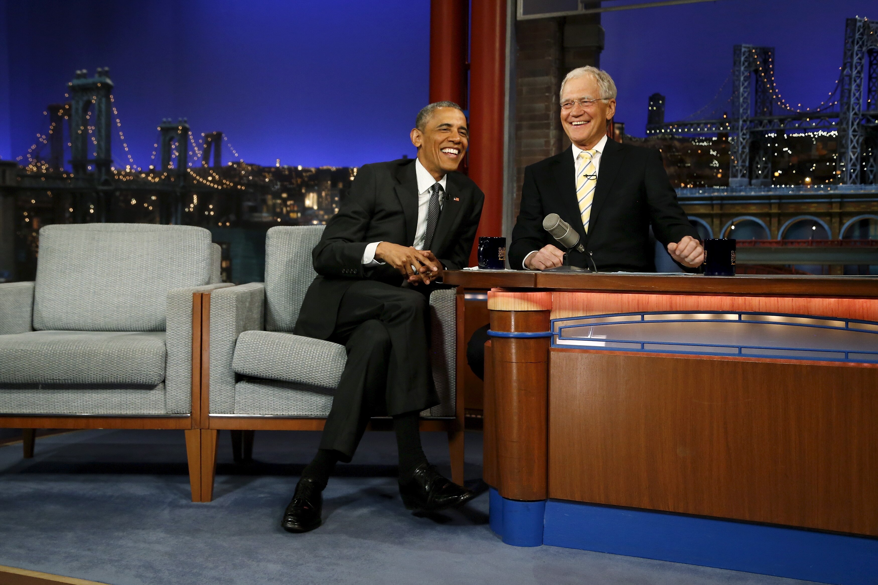 Barack Obama and David Letterman share a laugh on the set of Letterman's Late Show.