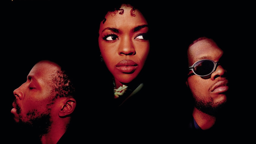 The heads of Fugees members Wyclef, Lauryn Hill and Pras against a black background. From the cover of their album The Score